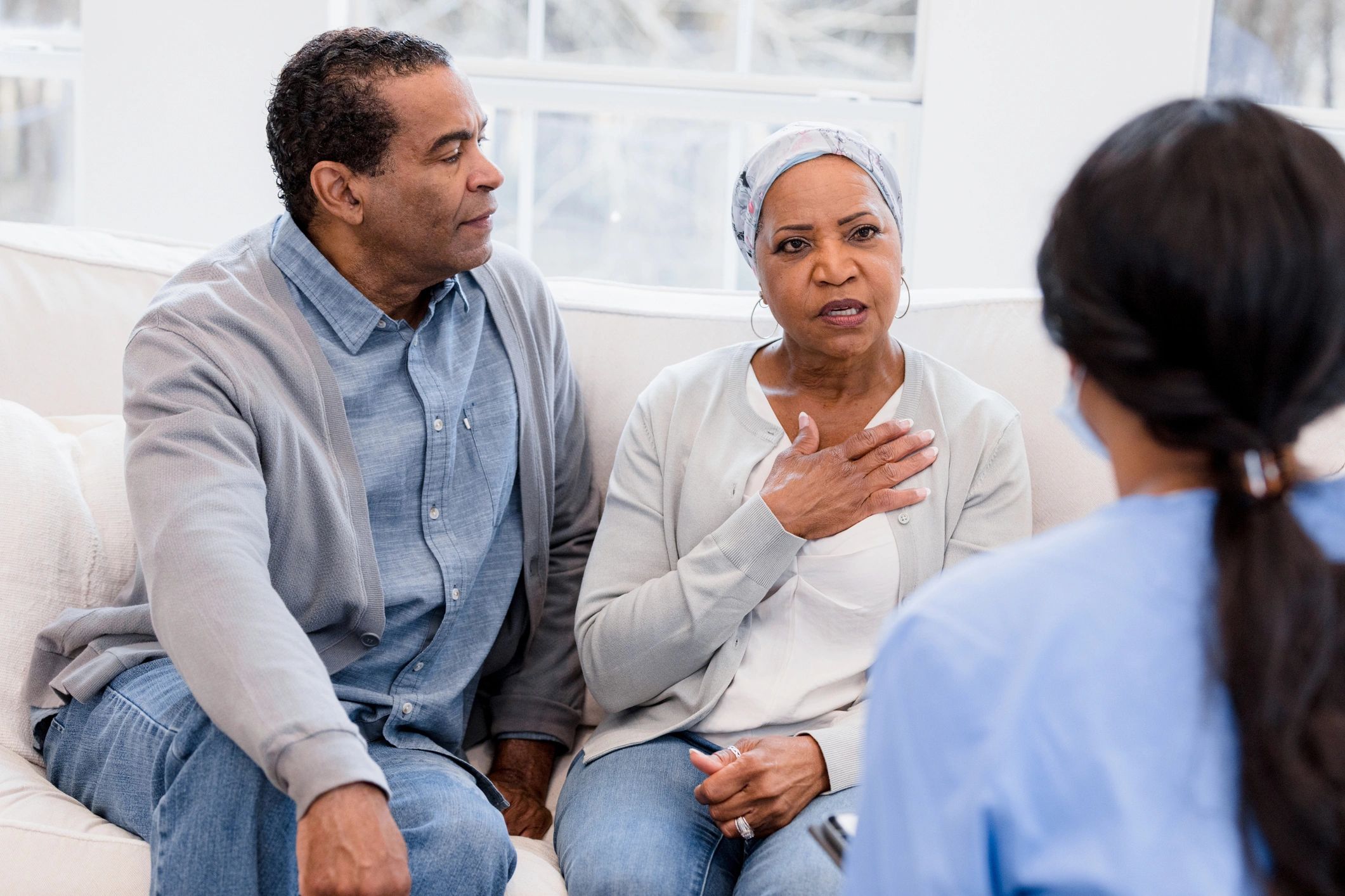 Nurse speaking with a senior woman in a care setting