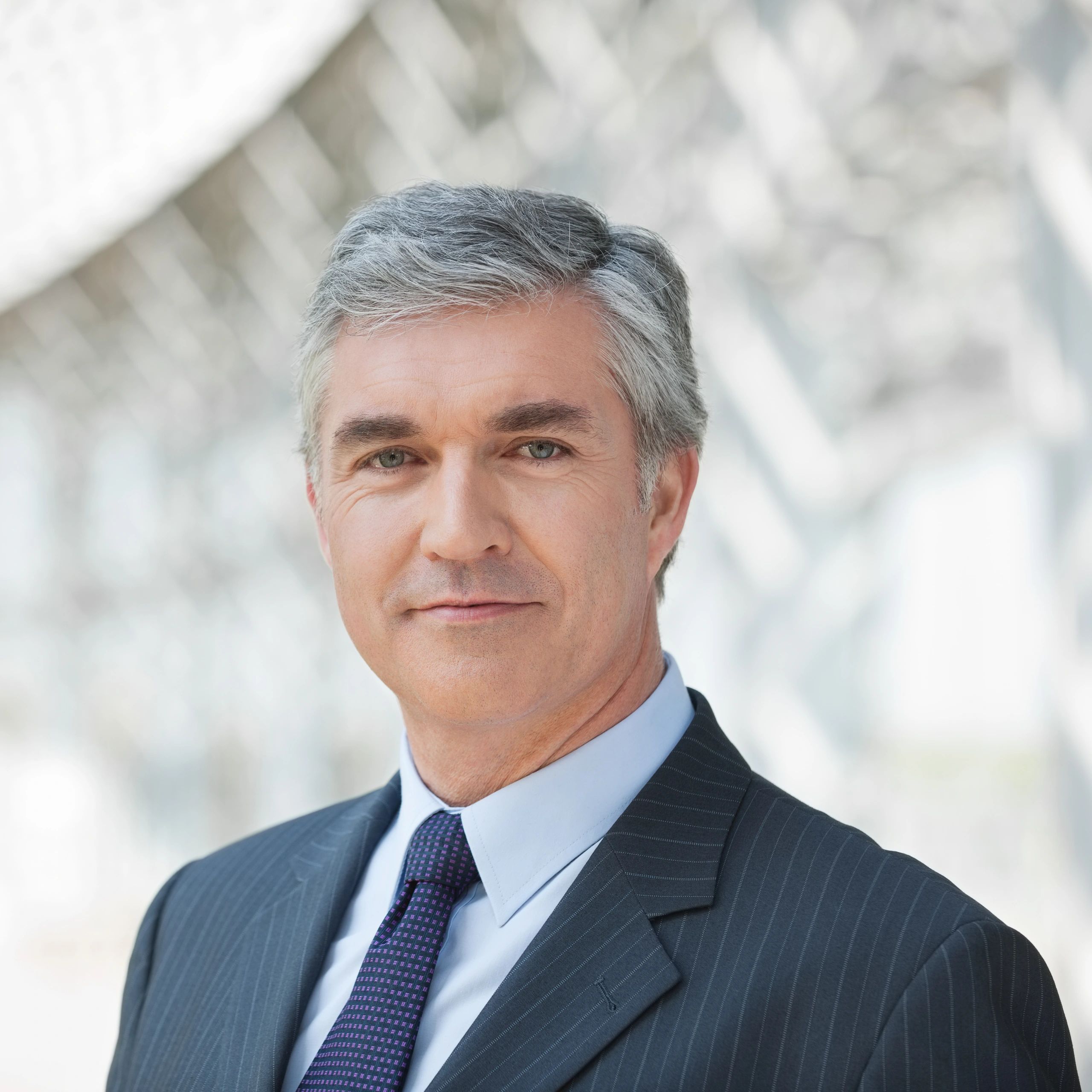 Professional headshot of a confident businessman