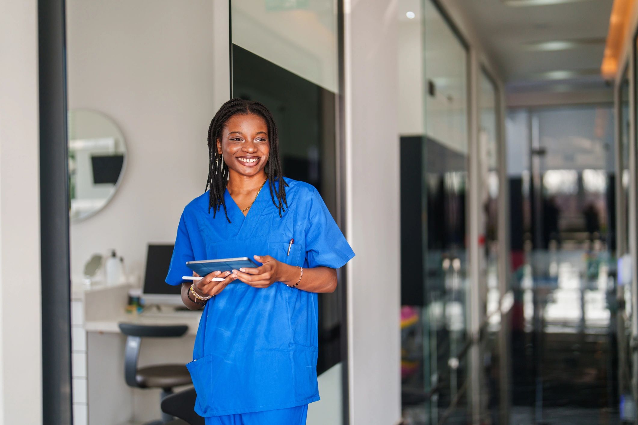 Staff member using a tablet connected to facility Wi‑Fi